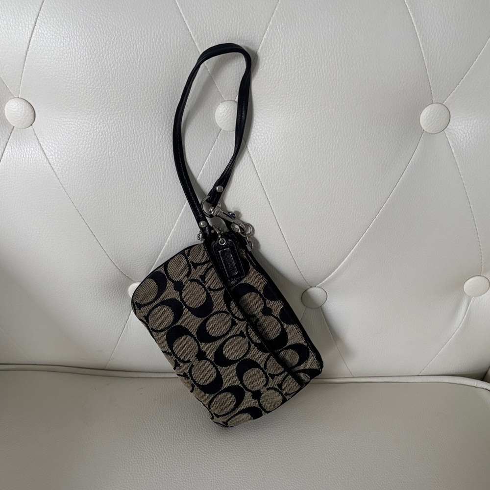 Coach Monogram Canvas Wristlet Black and tan Signature
 ( PREOWNED)